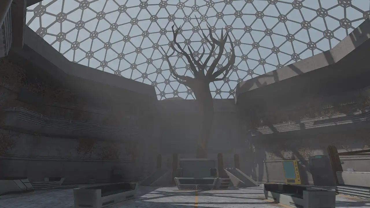 A bare tree beneath the geodesic glass roof of the biodome